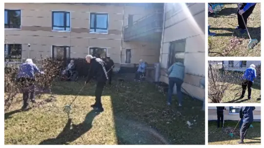 Bilde av ansatte og bebeoere som jobber i hagen på Langelandshjemmet.